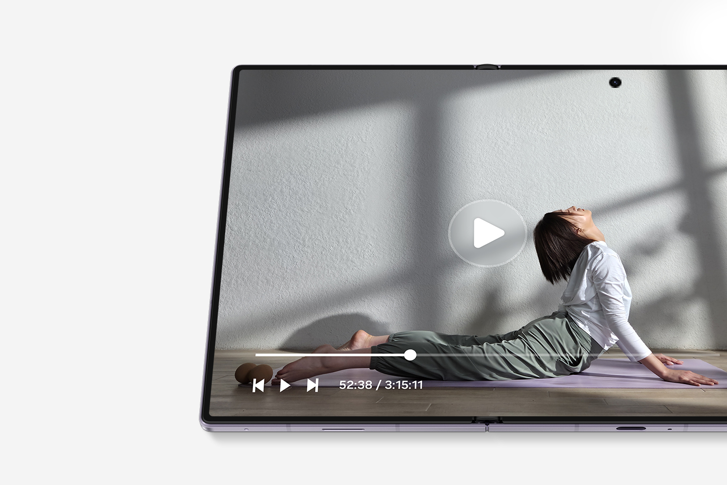 A close-up of the unfolded Galaxy Z Fold8 main screen playing a video of a person doing yoga. The video player interface indicates that the viewer is 52 minutes into a three-hour video, highlighting the device's long-lasting screen time. 