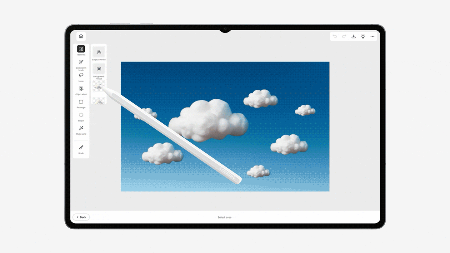 A GIF showing Adobe Photoshop on the Galaxy Tab S12 series. The S Pen is shown inserting the image of a cloud on a magazine cover. 