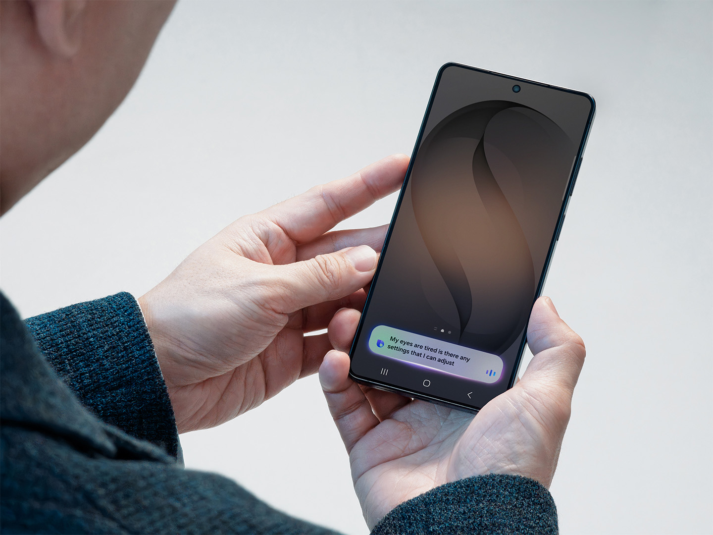 Samsung Bixby interface on a Galaxy phone with the question, “My eyes are tired. Is there any setting I can adjust?”
