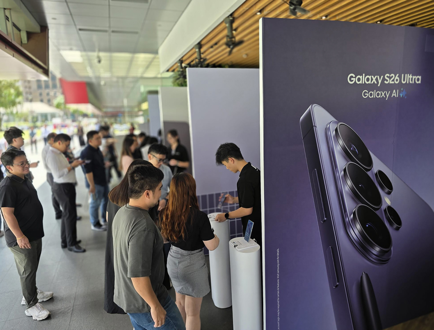 Visitors in front of the Samsung booth featuring Galaxy S26 Ultra branding. 
