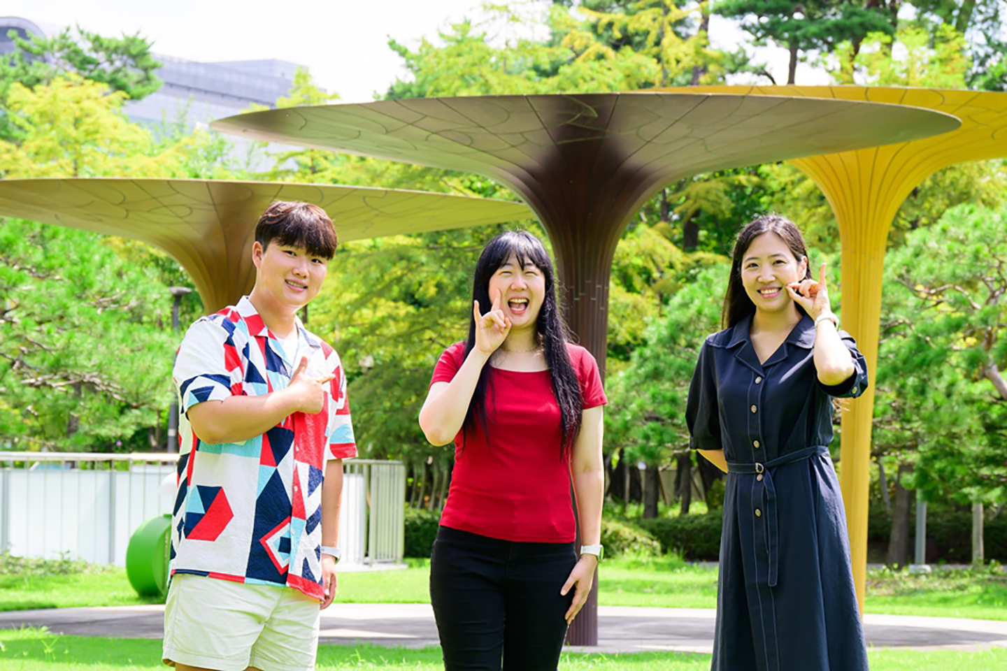 Two Samsung Supporters and one Samsung employee pose for the camera, standing side by side.