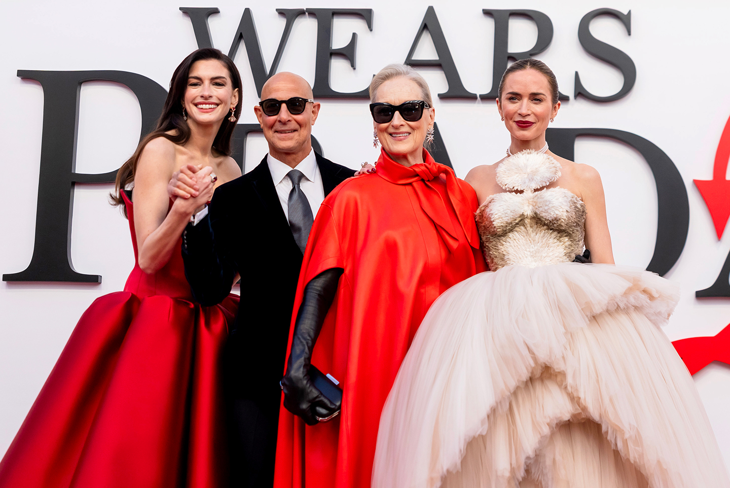Anne Hathaway, Stanley Tucci, Meryl Streep and Emily Blunt pose for the camera at the world premiere of The Devil Wears Prada 2.